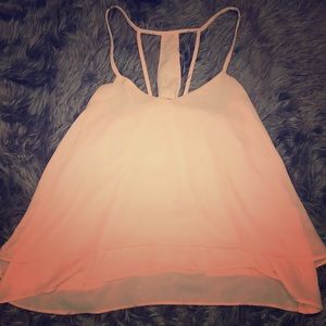 A peach color spaghetti strap shirt